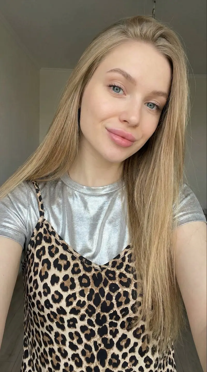 Preview of Close-up Selfie of a Young Woman with Leopard Print Top