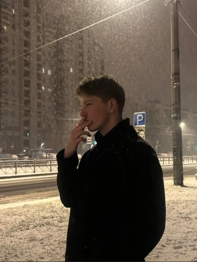 Preview of Photorealistic Night Portrait of Man Smoking in Snow
