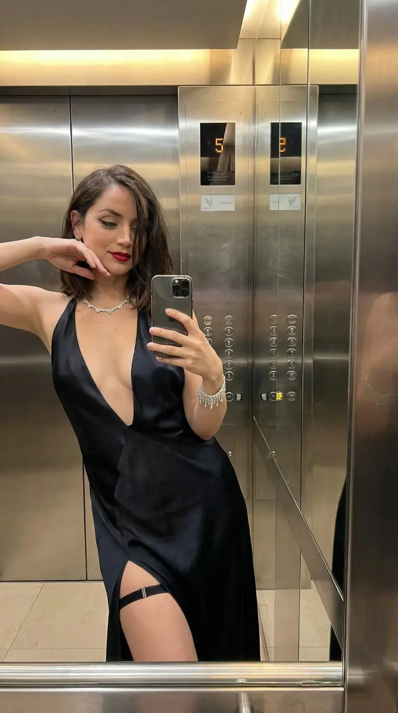 Preview of Luxury Elevator Mirror Selfie in Deep V-Neck Dress