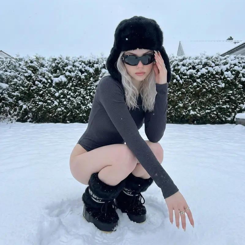 Preview of Winter Editorial Low-Angle Squat Pose Prompt (iPhone Style)