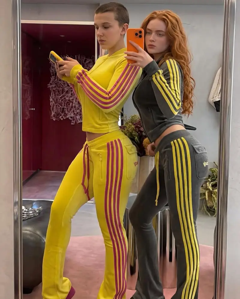 Preview of Mirror Selfie of Two Women in Velour Tracksuits